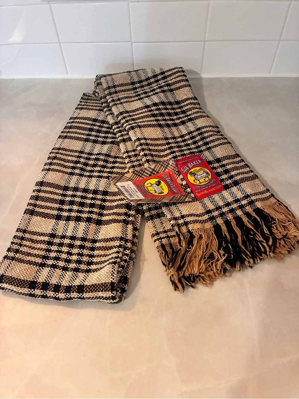 Perfect gift or comfort for winter. Bakers Black and Tan Plaid Fringe scarf